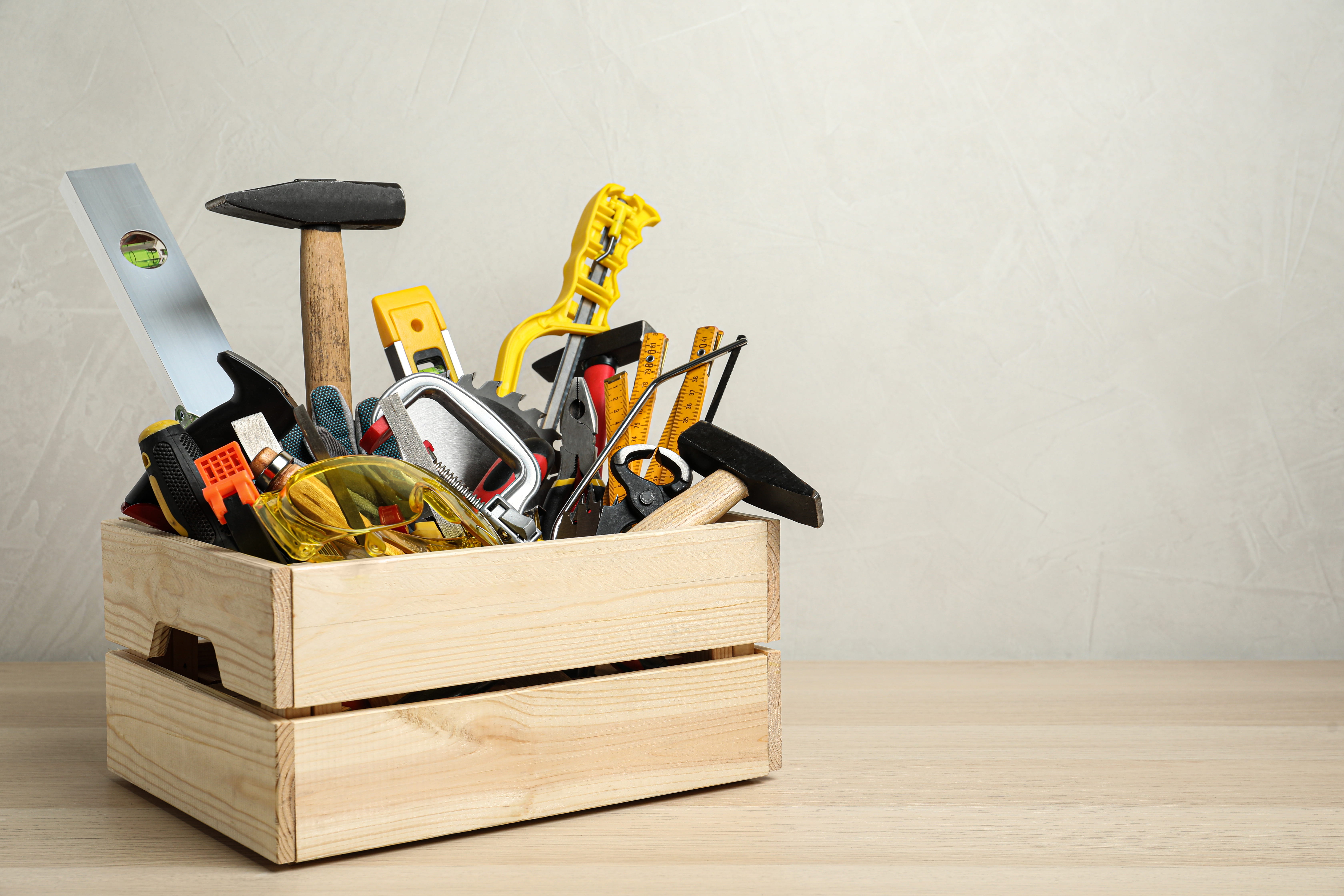 A box of tools, hammer, ruler, vice, etc. 