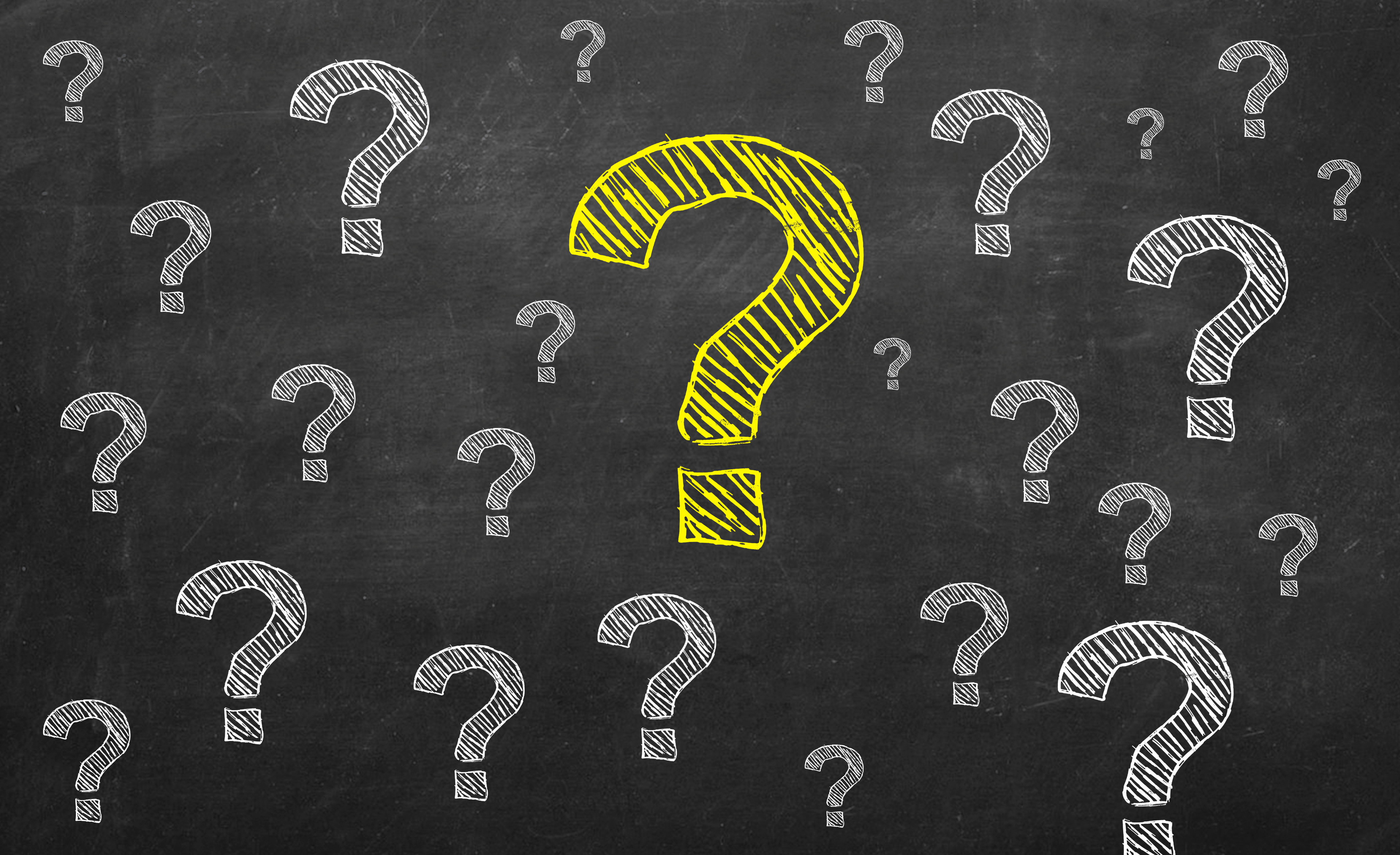 A lot of question marks, with a prominent yellow one in the middle.