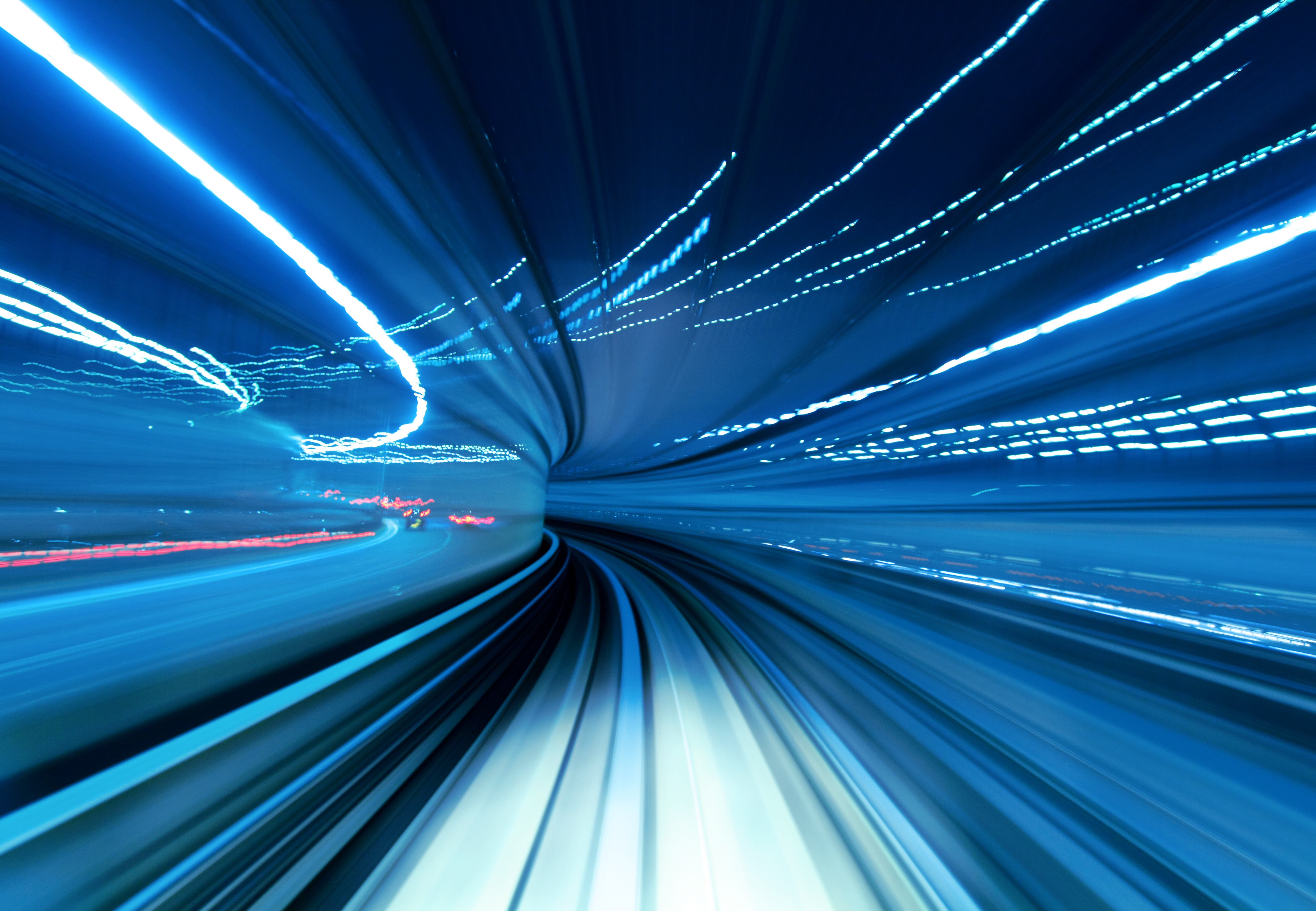 A fast motion blur of a train going through a tunnel