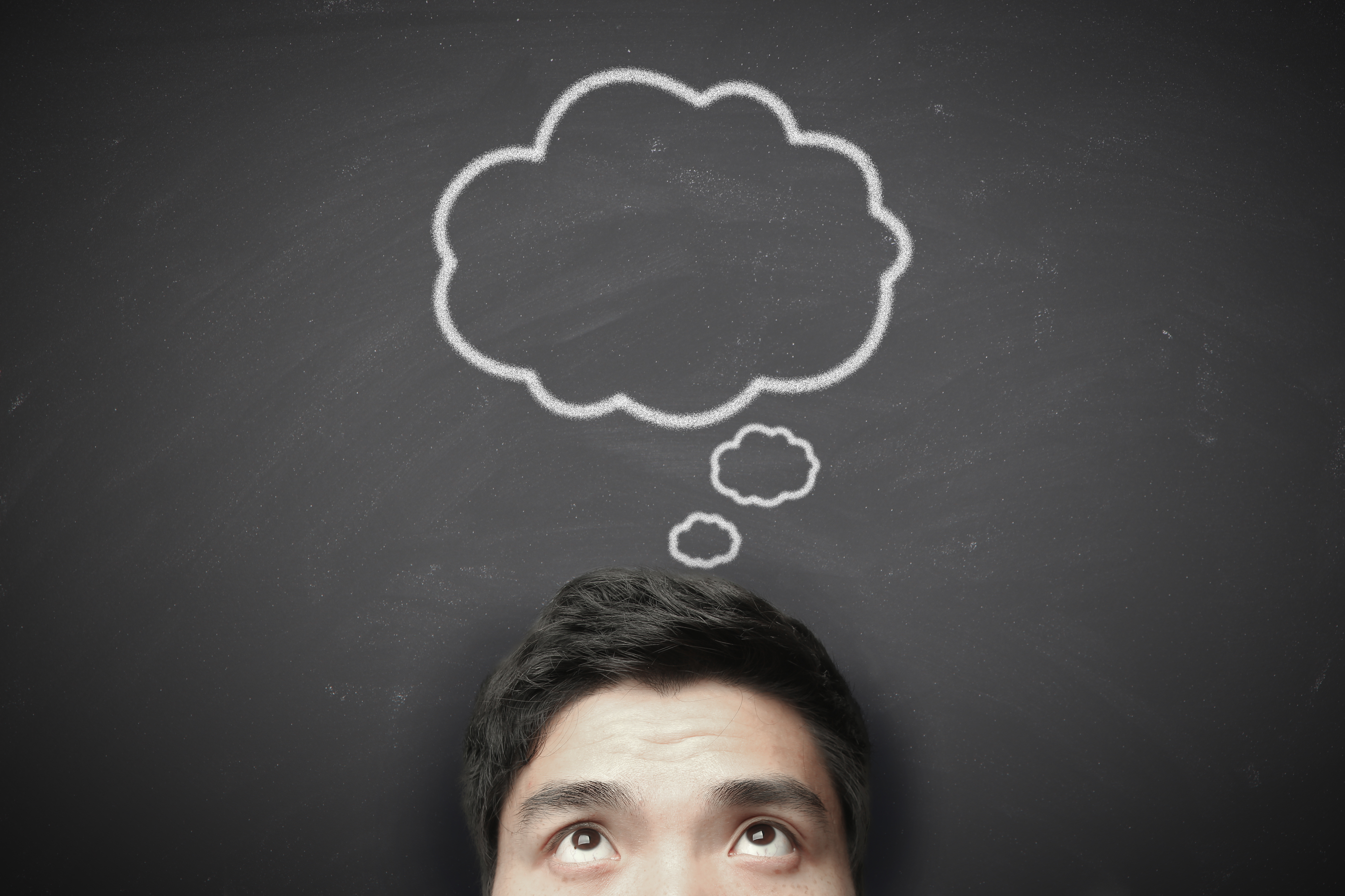 A thinking man with a thought bubble above his head.